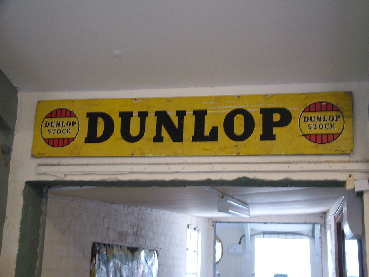 
	A Dunlop tin stock garage sign, originally displayed above Edgar's office door. It's in nicely patinated, original condition, ideal for the enthusiast's own garage.
