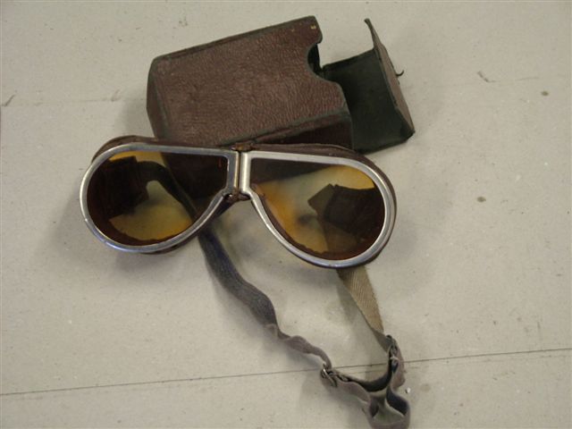 
	These first world war aviator's goggles have yellow tinted lenses and leather face pads. The elastic headband has stretched somewhat but the adjusters work perfectly so it's possible to 
